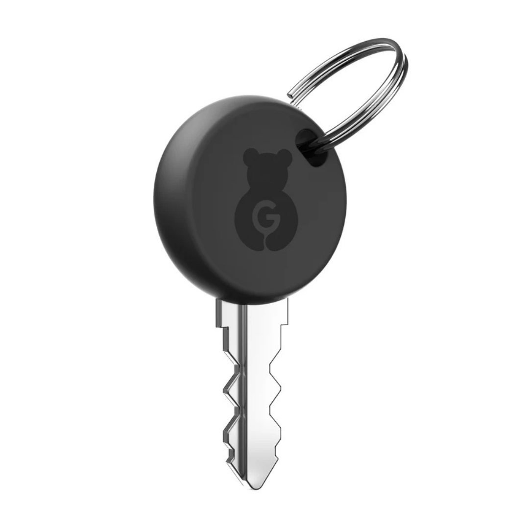 A silver key with a round black plastic head showing a bear outline and G in the center, attached to a metal keyring—perfect as a replacement accessory for Paiseec Mobility Scooter Parts.
